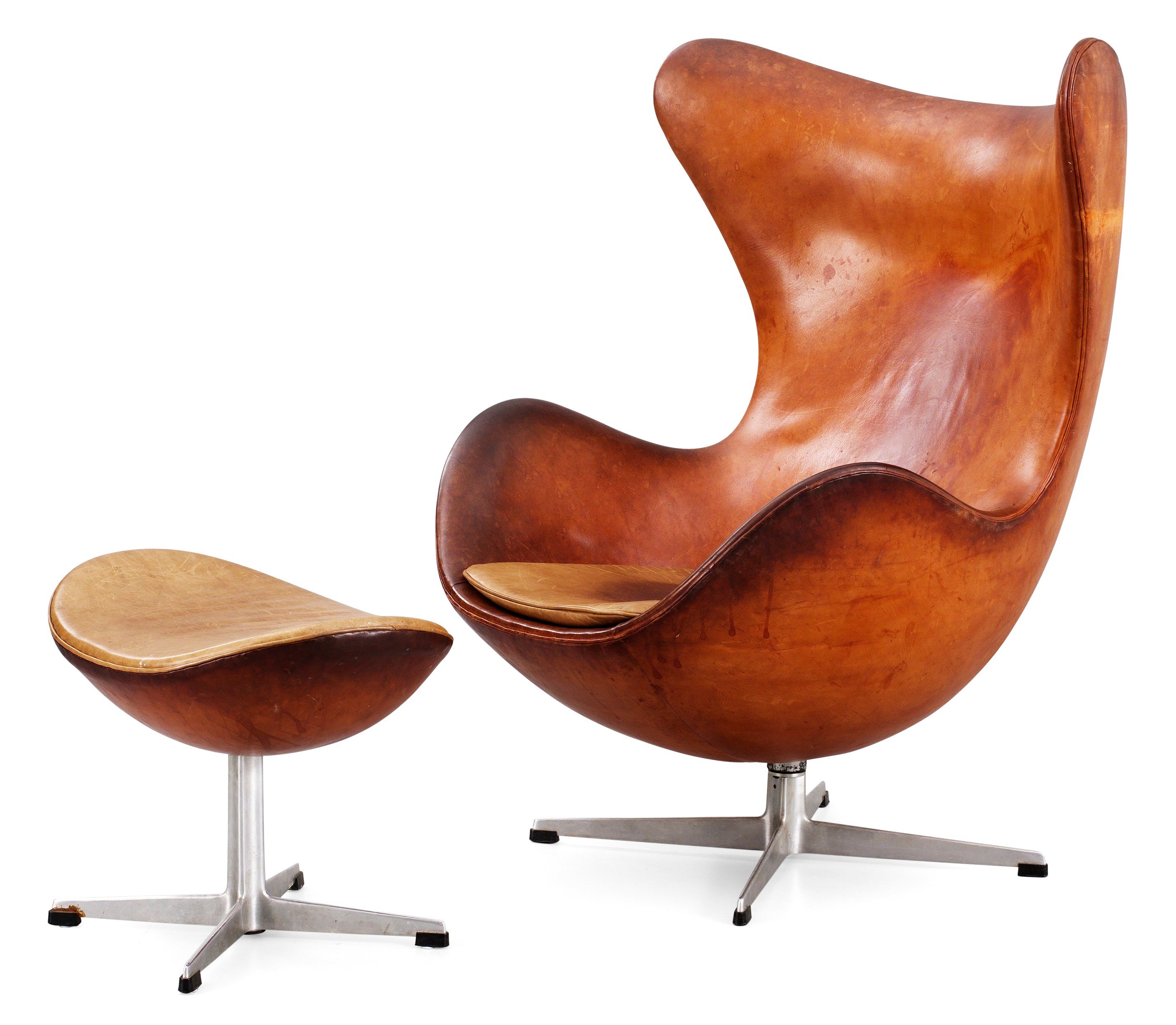 An Arne Jacobsen brown leather 'Egg chair' with ottoman, by Fritz