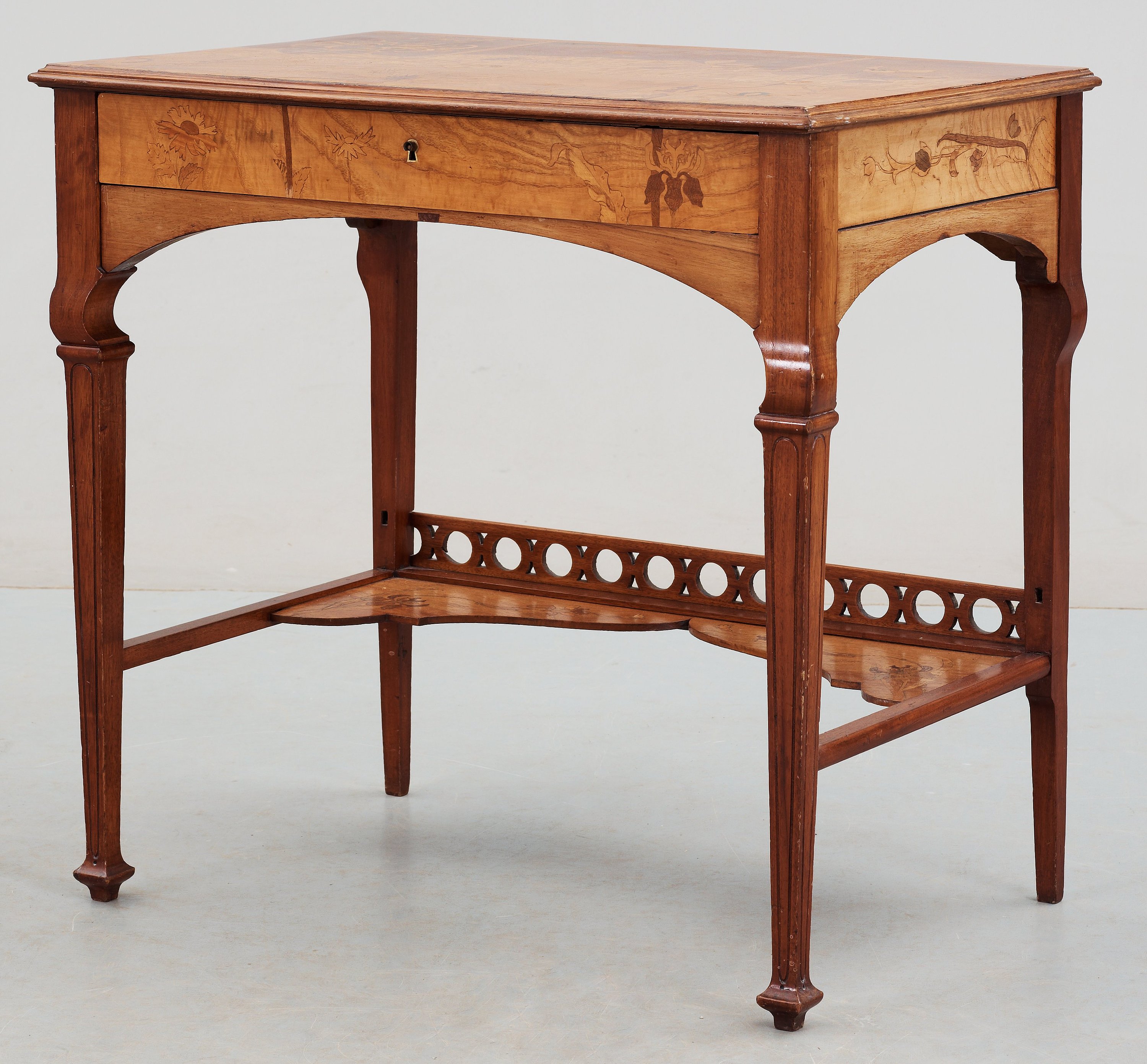 An Art Nouveau mahogany lady's desk with inlays of flowers in different