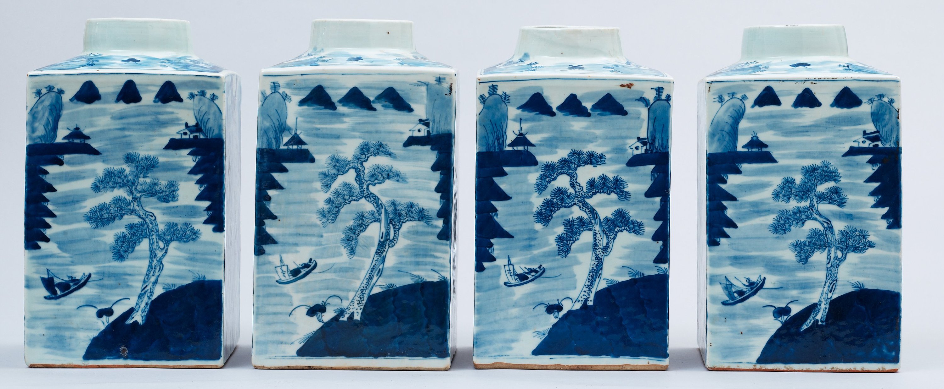 A set of four blue and white large tea caddies in a wooden box, Qing