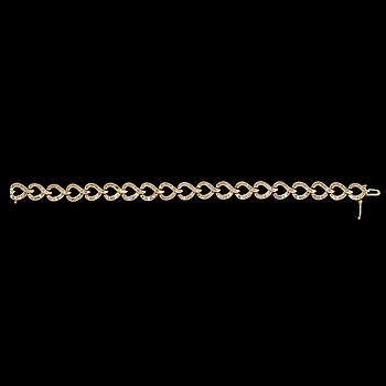 364911. ARMLÄNK, 10k guld och 14k vitguld med fasettslipade små diamanter, 2000-tal. Vikt 12 g.