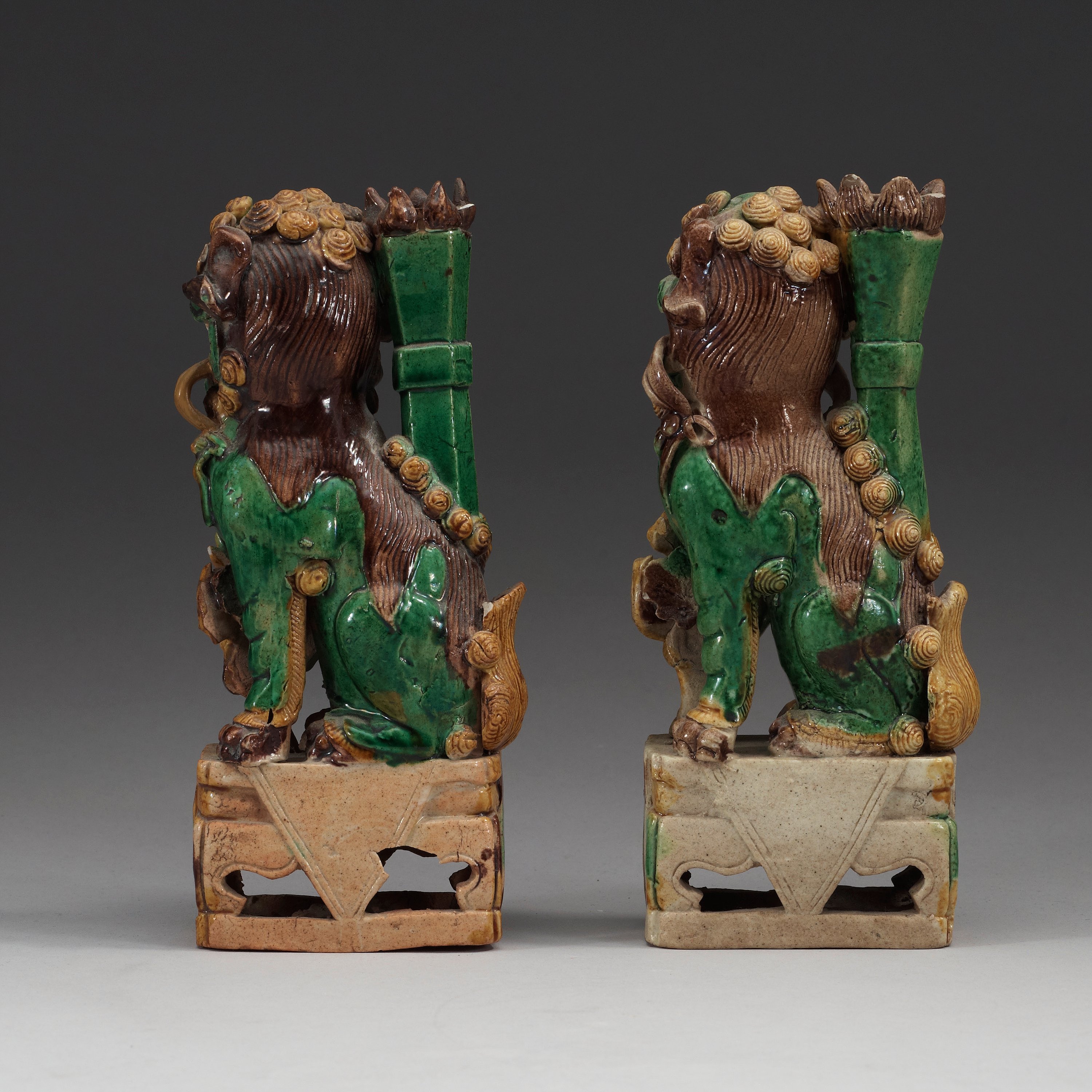 Two green, aubergine and yellow glazed bisquit joss stick holders, Qing