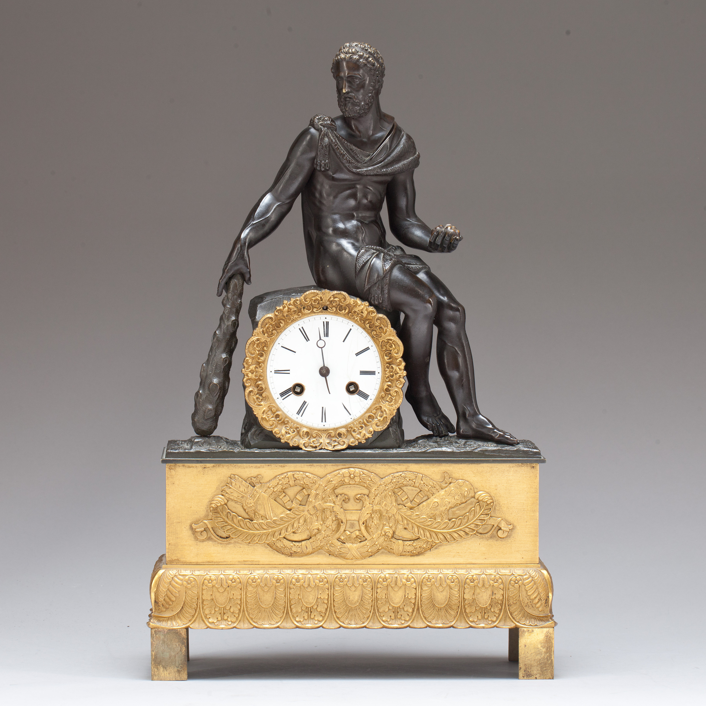 An Empire early 19th century gilt and patinated bronze mantel clock ...
