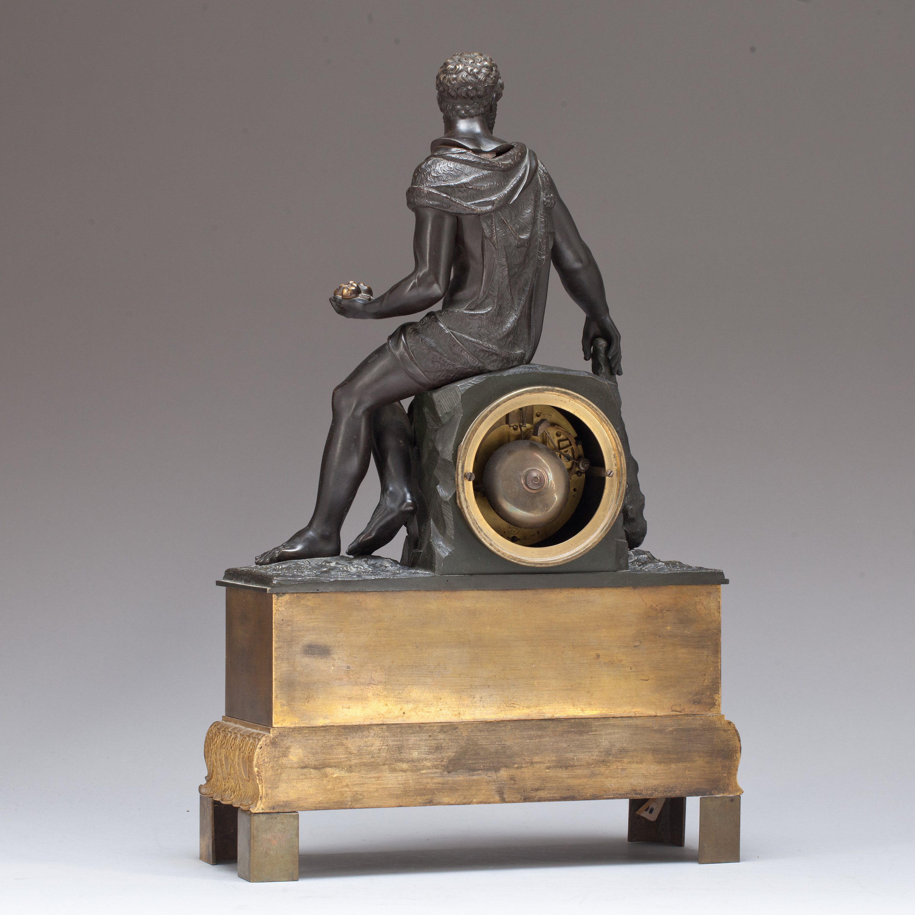 An Empire early 19th century gilt and patinated bronze mantel clock ...