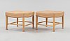 A pair of Josef Frank mahogany and beige leather stools, Svenskt Tenn, model 902.