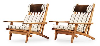 38. A pair of Hans J Wegner oak and fabric easy chairs, Getama, Gedsted, Denmark 1950's-60's.