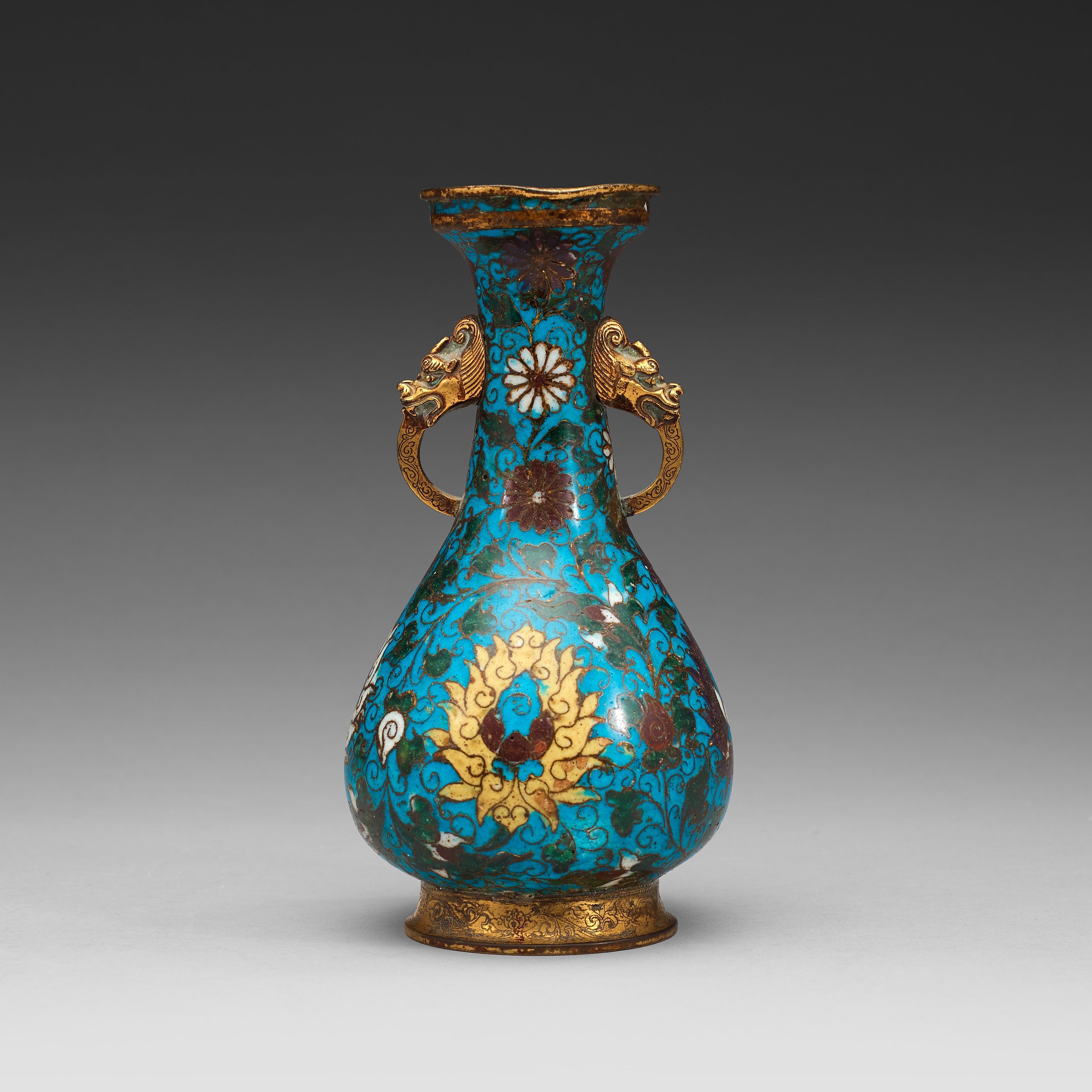 A cloisonné vase decorated with lotusscrolls, and dragon shaped