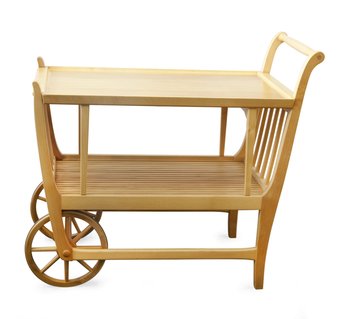 206. A PINE TEA TROLLEY,