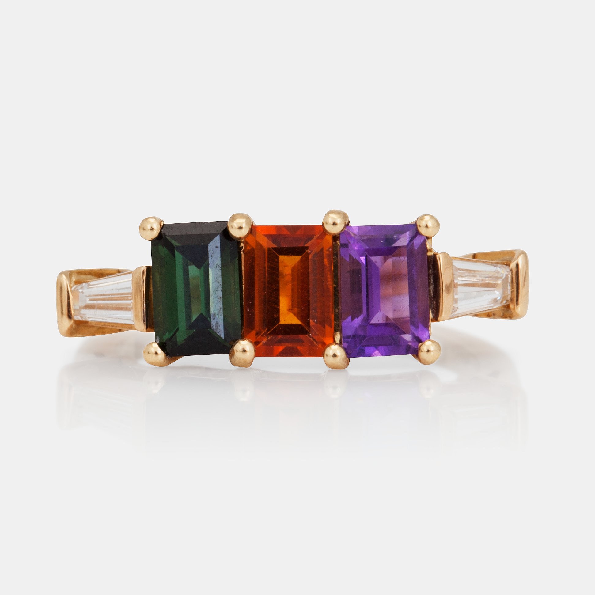 A stepcut tourmaline, amethyst, citrine and trapezecut diamond ring