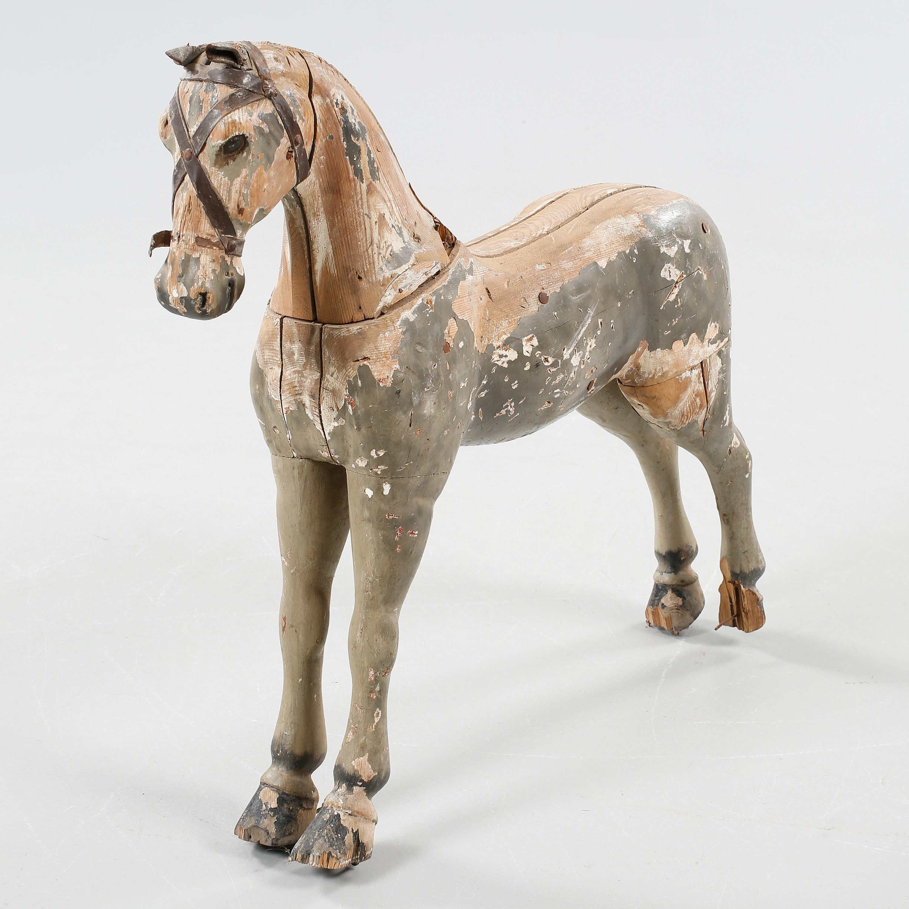 A wodden toy, made like a horse from the first half of the 20th century