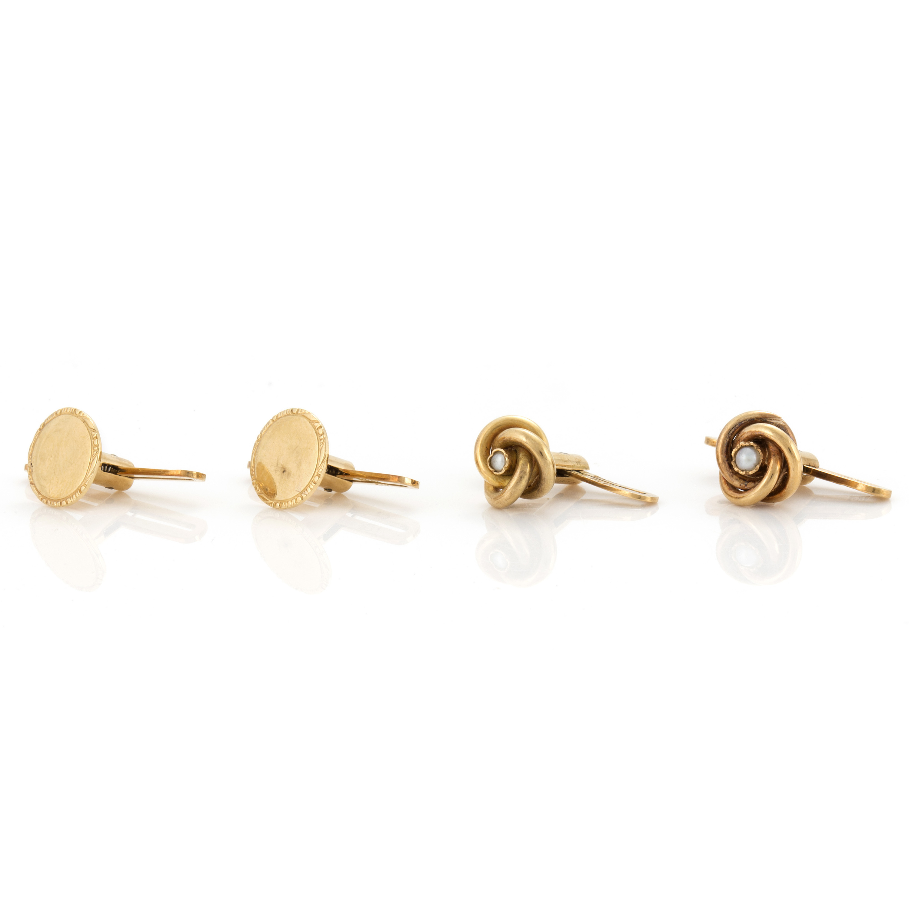 Four 18K gold dress studs. Bukowskis