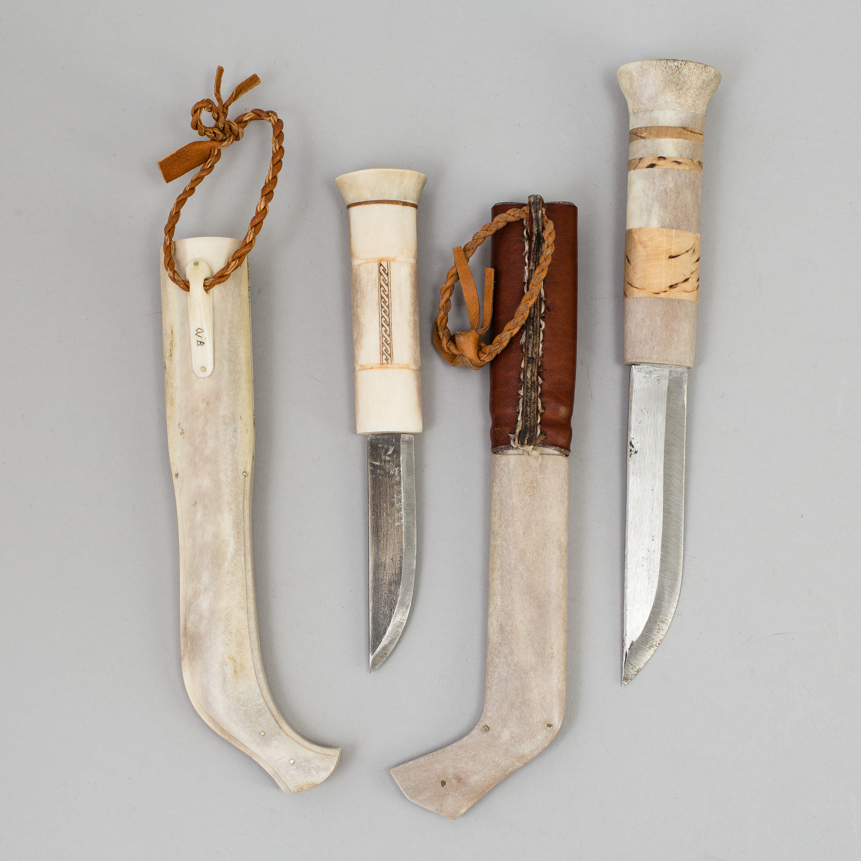 Two traditional sami knives, one by Per Henrik Simmas. Signed. Bukowskis