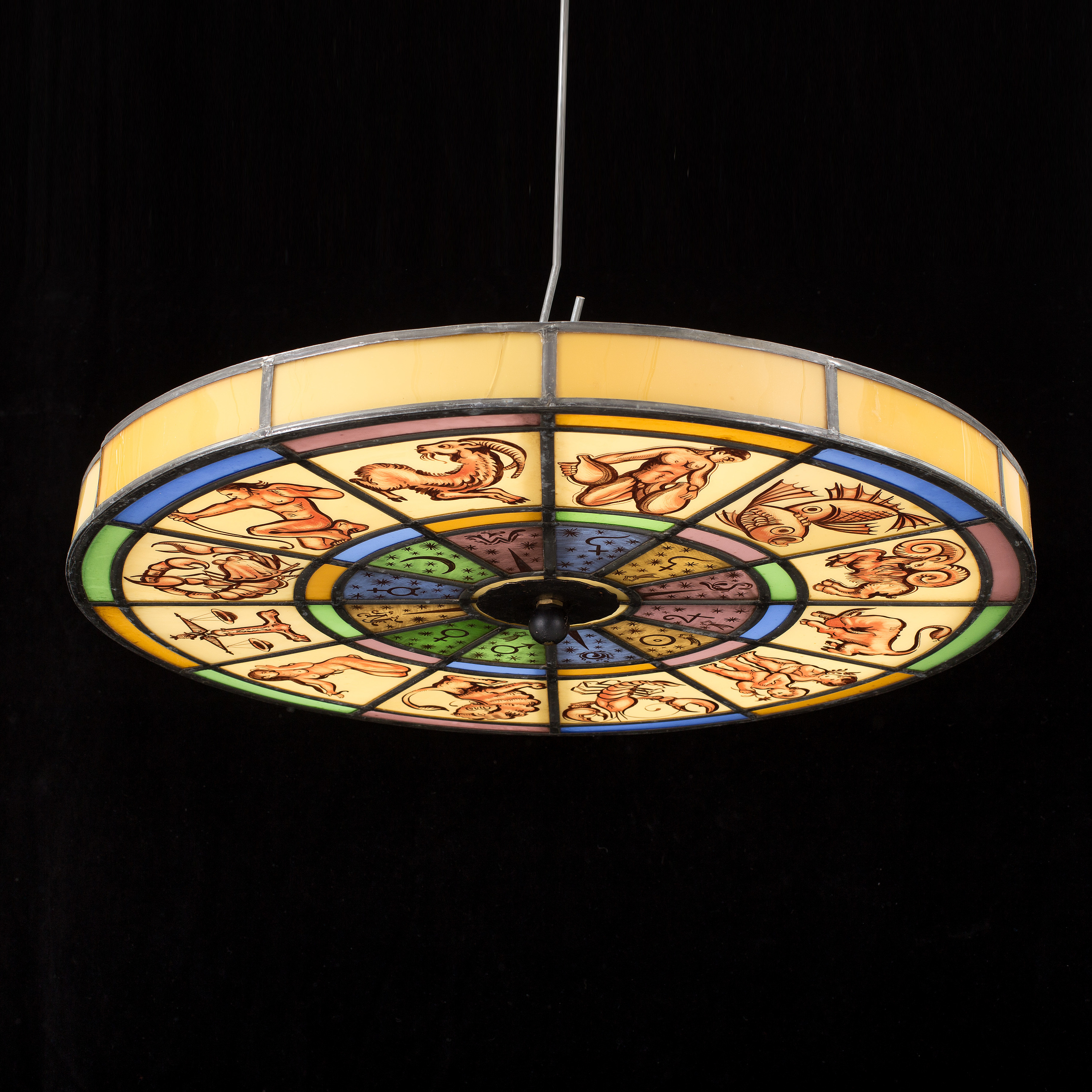 A 1920's glass ceiling light decorated with the zodiac. Bukowskis