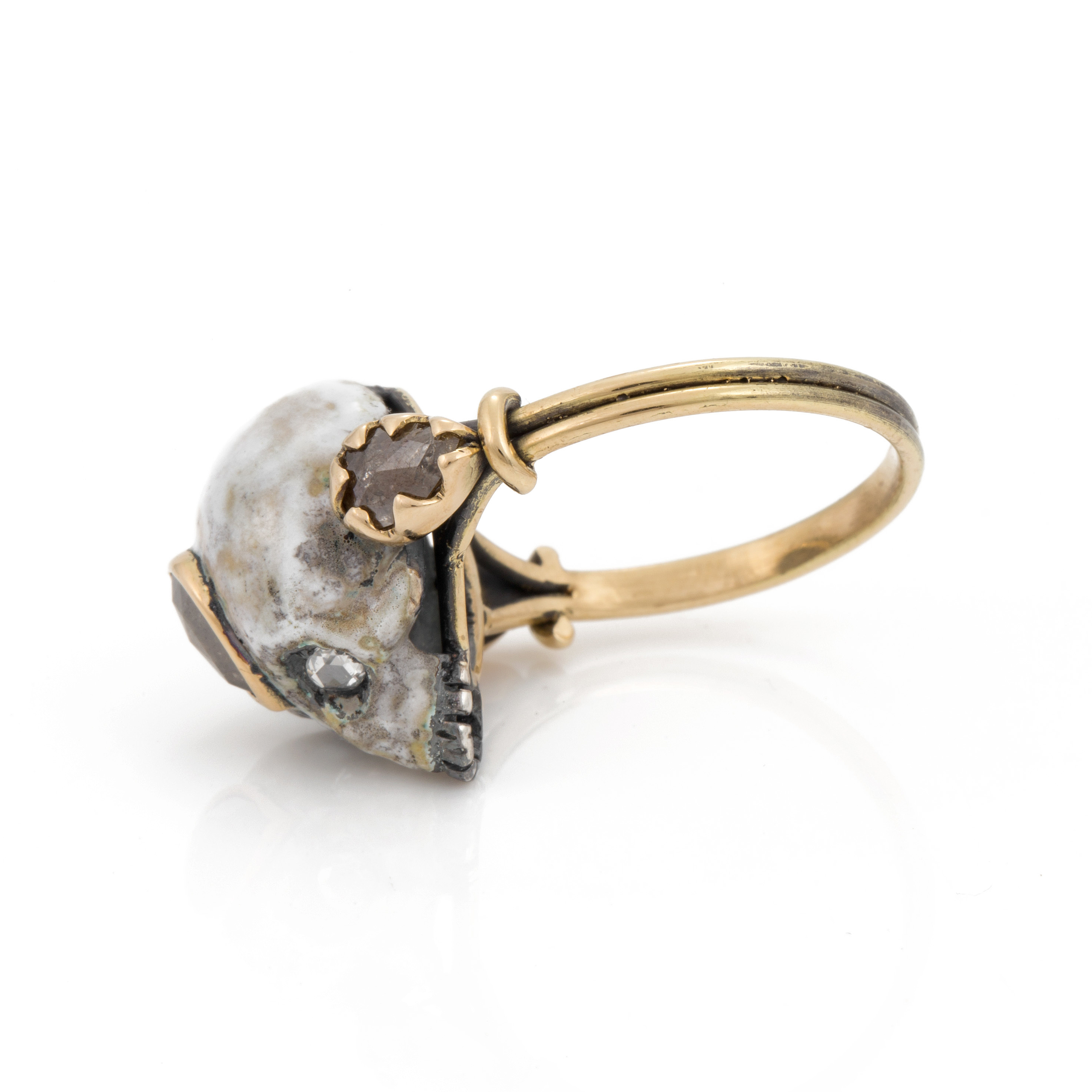 A memento mori style ring with an enamelled skull set with rose cut ...