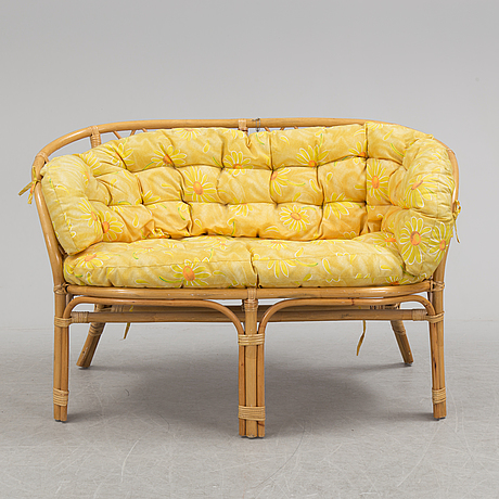 A 1970s four piece set of rattan garden furniture. - Bukowskis
