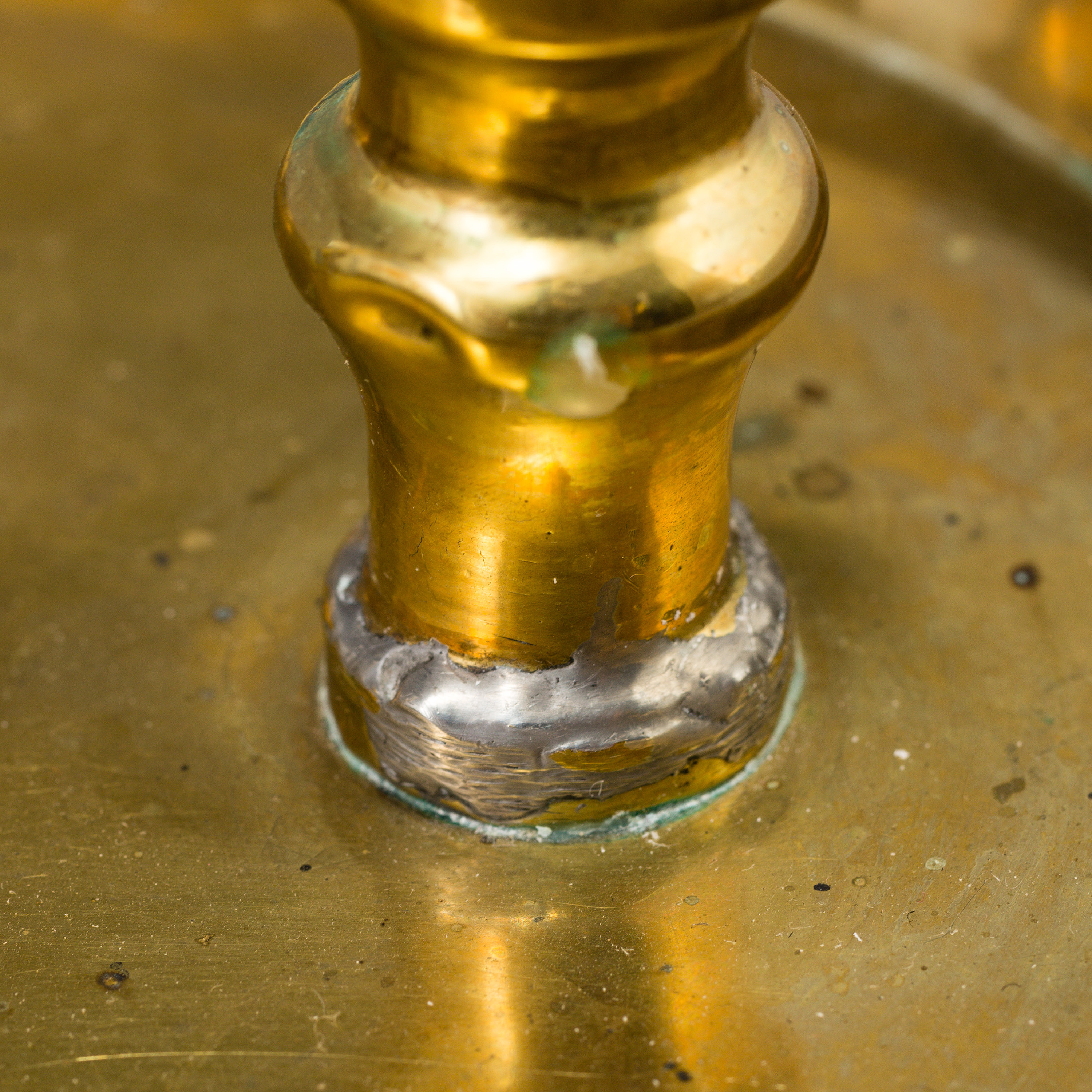 A 19th century bra candleholder for two candles and candle wick