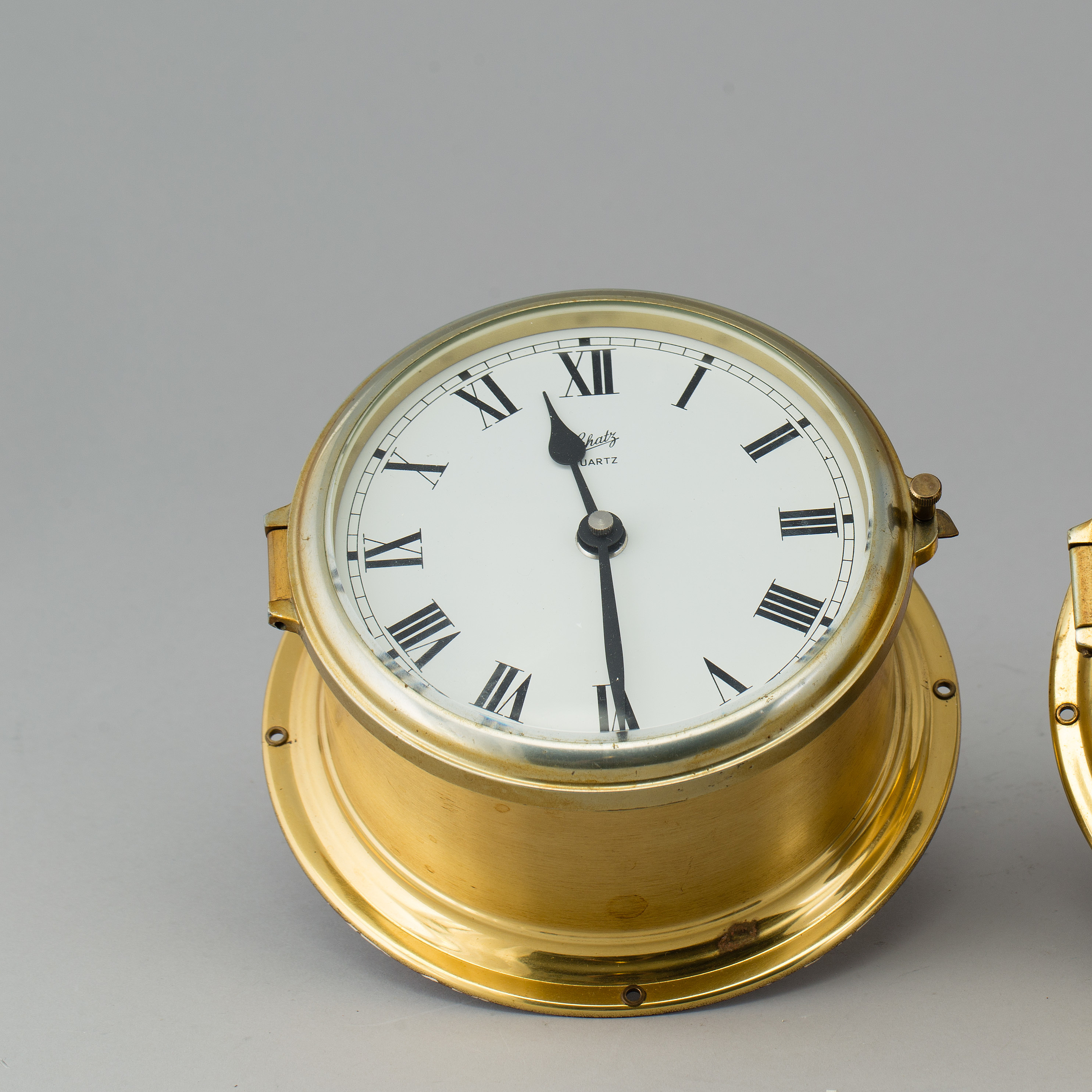 A brass barometer and clock, Schatz, 20th century. Bukowskis