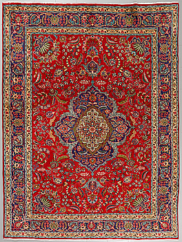 A Täbriz rug, 330 x 248 cm.