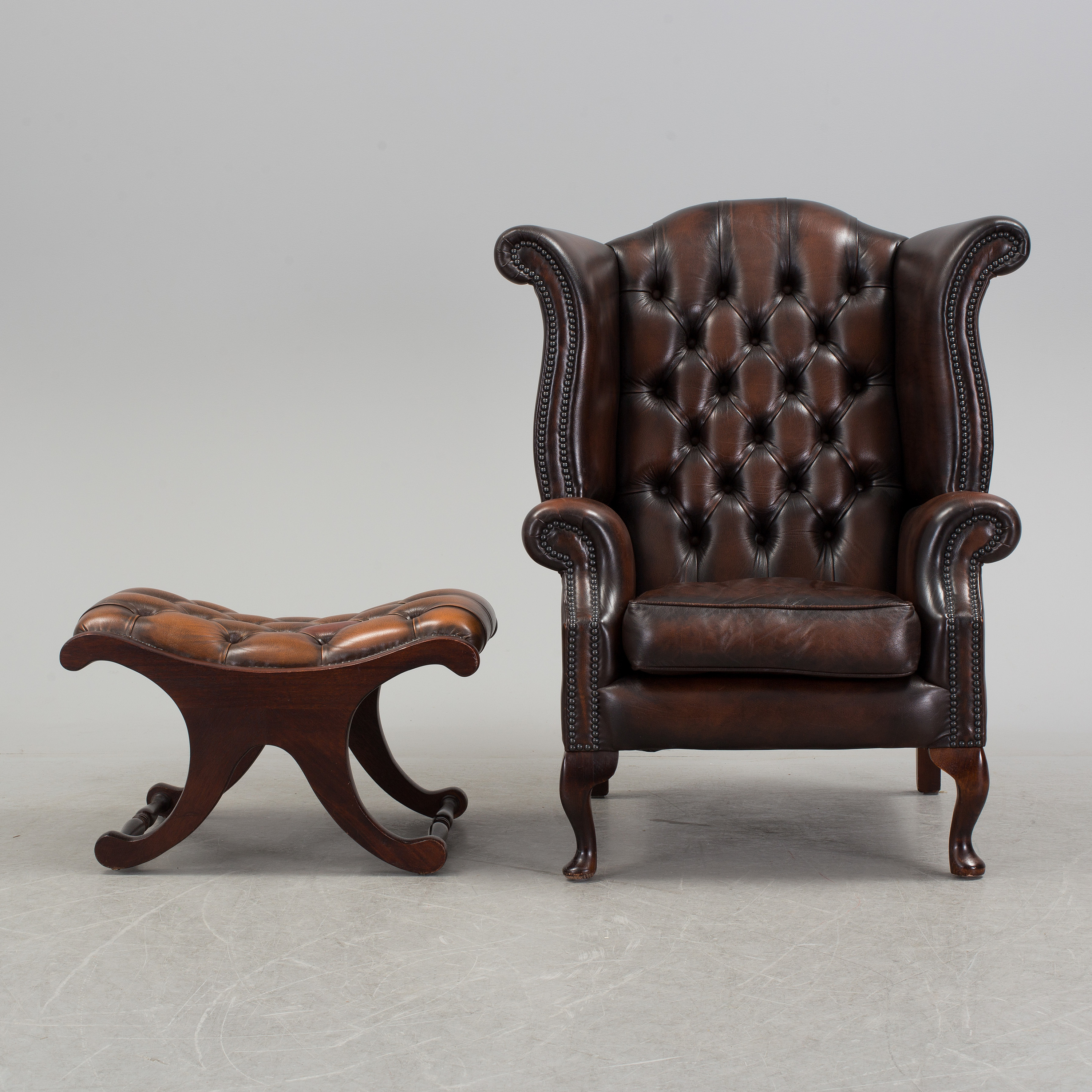 A late 20th century easy chair and ottoman. Bukowskis