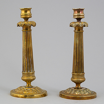 A pair of Empire bronze candlesticks, 19th century.