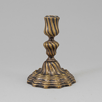 A 18th century bronze candlestick.