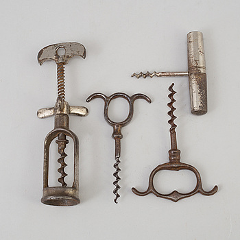 FOUR CAST IRON CORK SCREWS, 19th century.