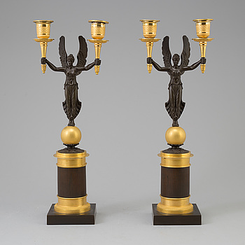 A pair of Empire bronze candelabra, first half 19th century.