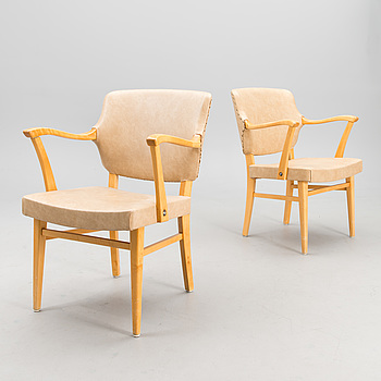 A pair of mid-20th century open armchairs.