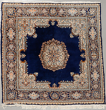 A Kirman rug, old, 215 x 215 cm.