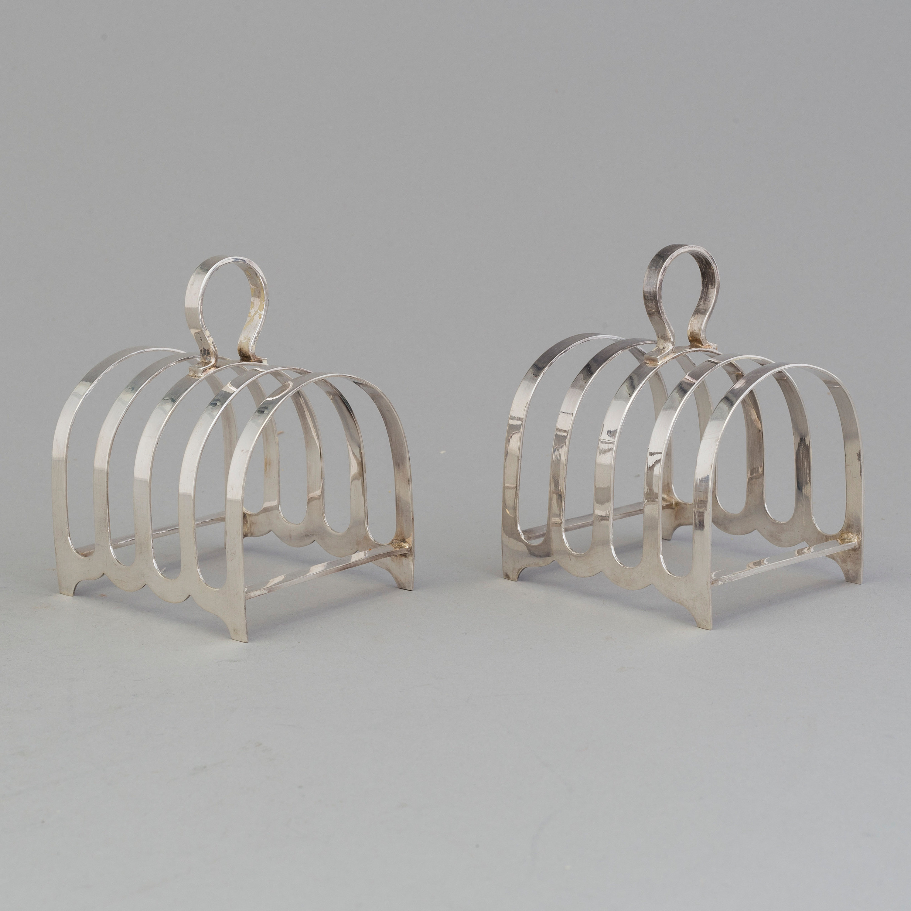 A pair of silver toast racks by Robert F. Mosley, Sheffield, England ...