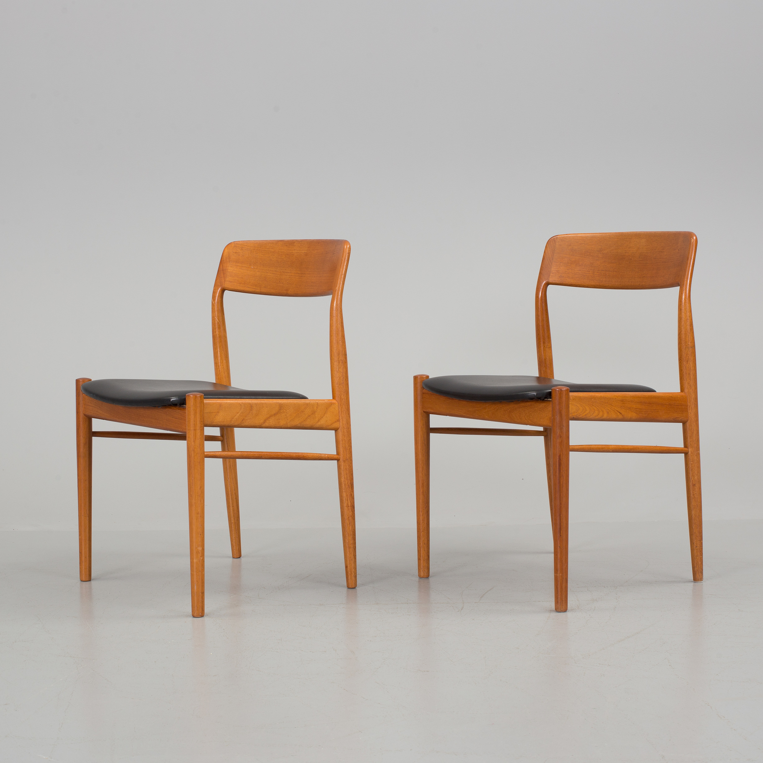 A teak dining table and eight chairs, second half of the 20th century