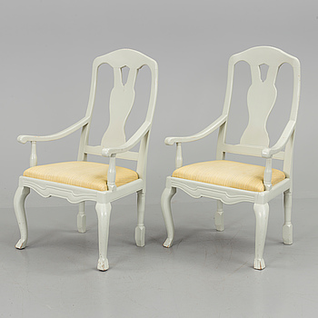 A pair of 19th century painted armchairs.