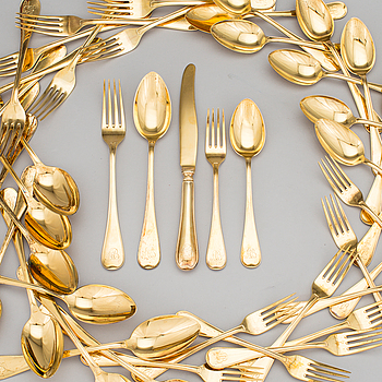 A set of 60 pieces of cutlery gilded sterling silver by CG Hallberg in Stockholm 1957-1961. Total weight c. 3950 gram.