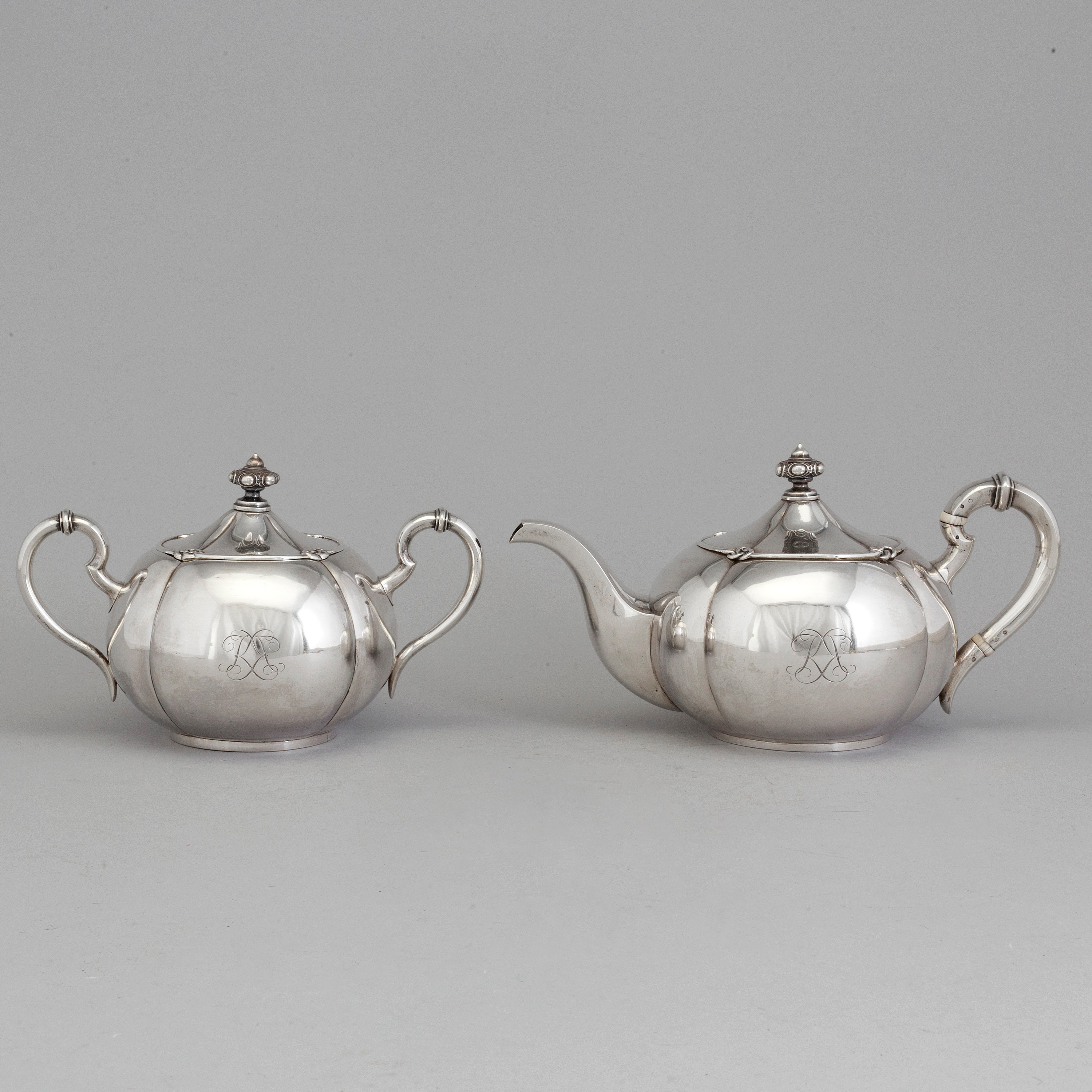 A 2piece Russian silver tea set, marks of Sazikov and Branderburg, St