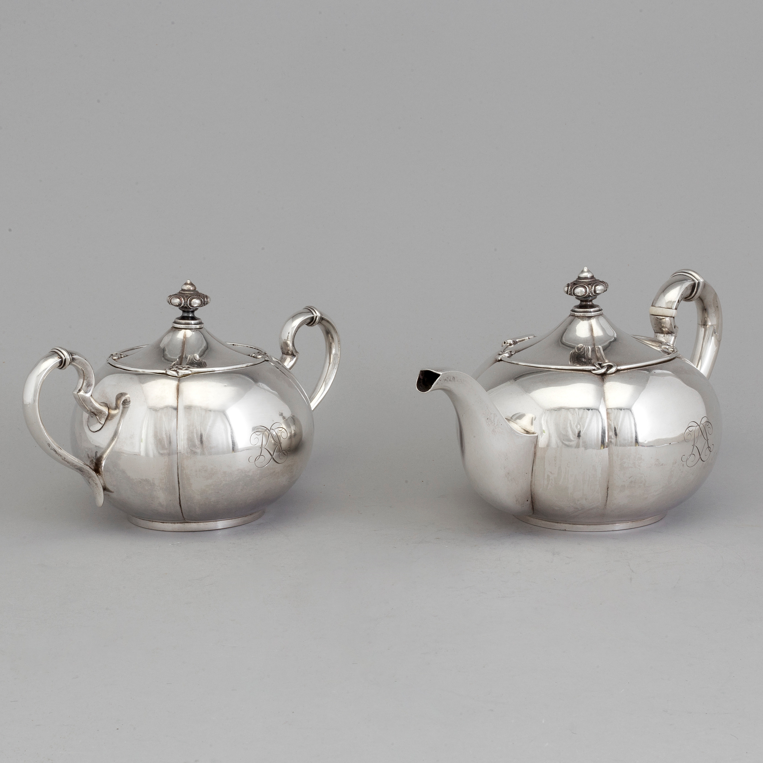 A 2piece Russian silver tea set, marks of Sazikov and Branderburg, St Petersburg and Riga 1853