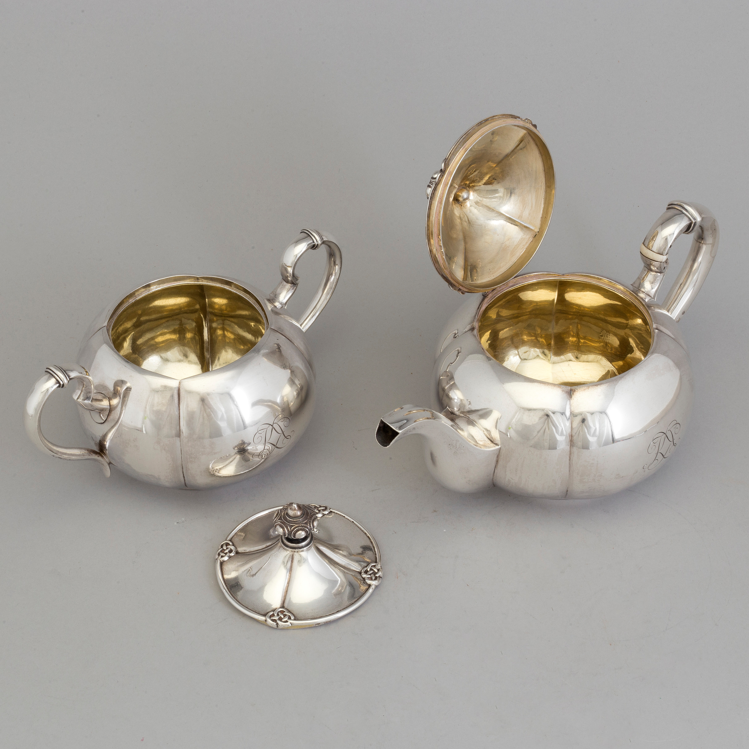 A 2piece Russian silver tea set, marks of Sazikov and Branderburg, St