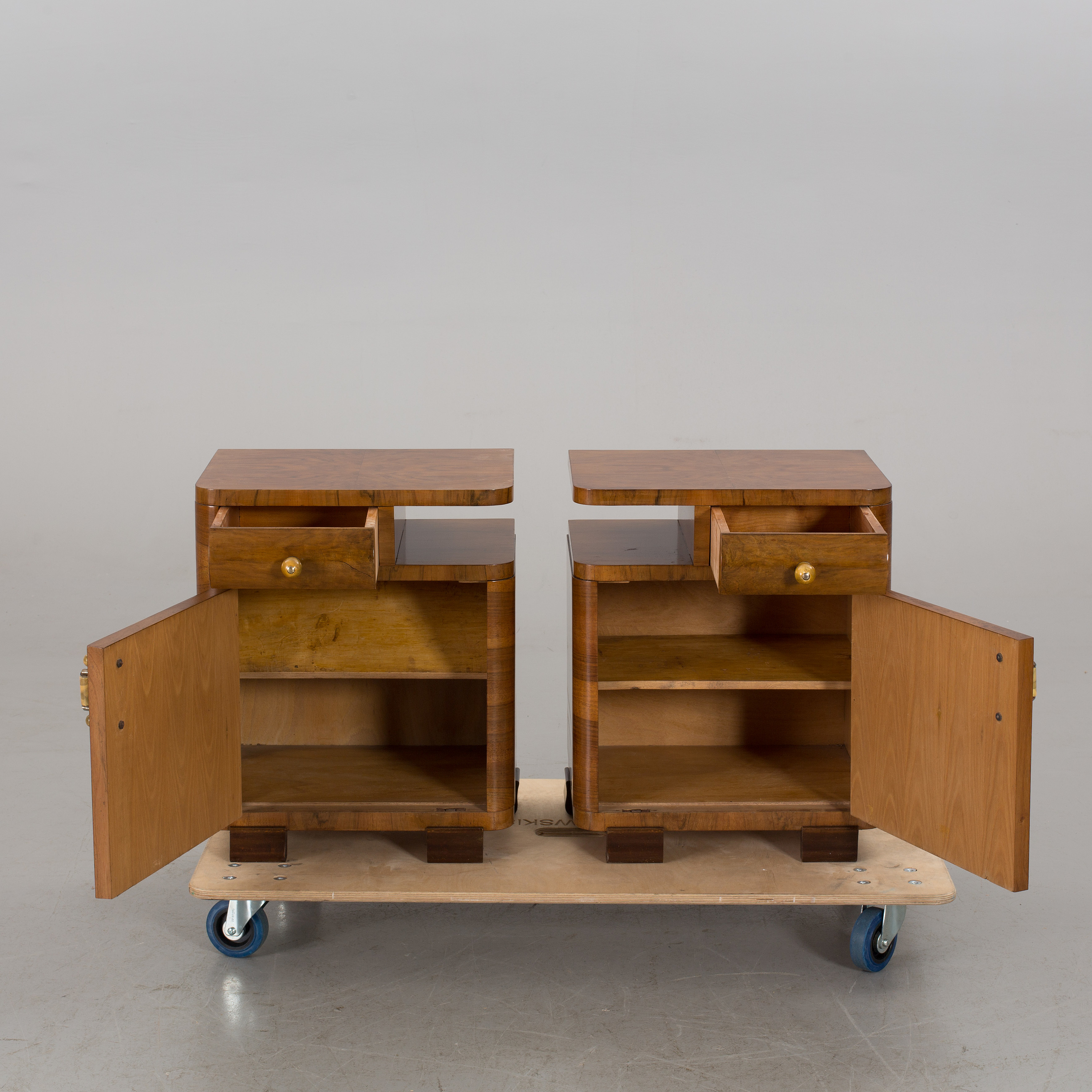 A pair of Art Deco style bedside tables first half of the 20th century