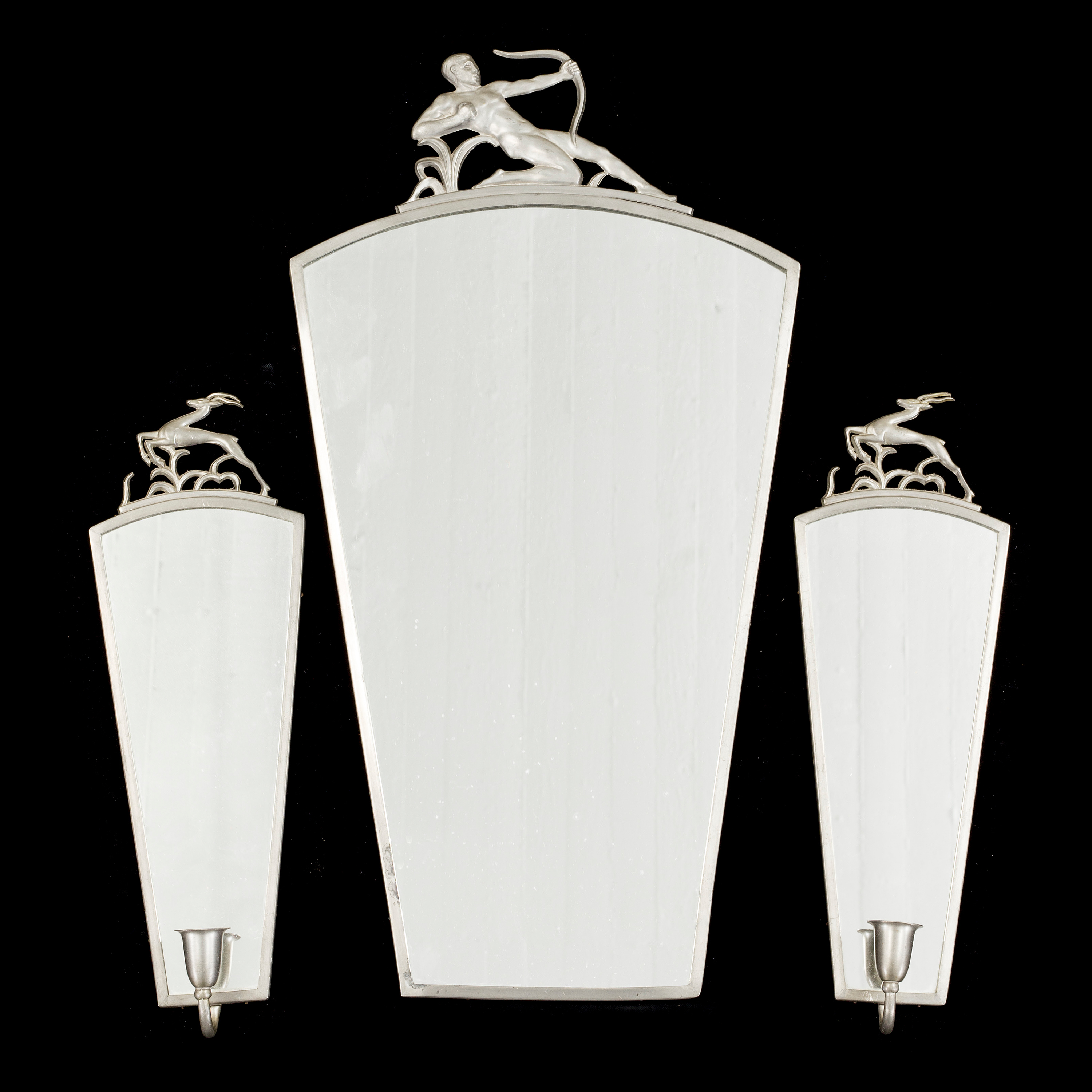 An Art Deco 1930s pewter mirror and a pair of wall sconces for one