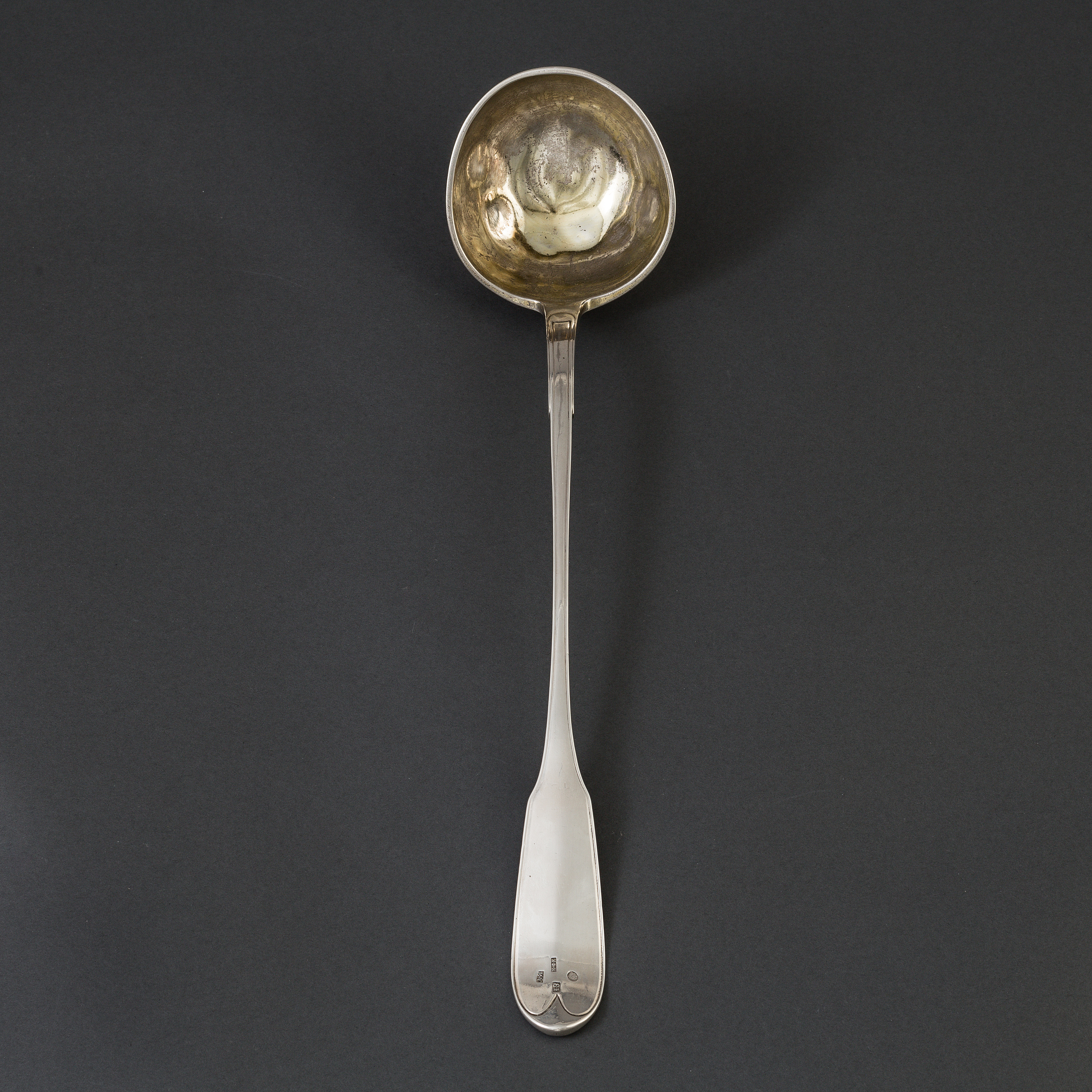 A Russian early 19th century parcelgilt silver ladle, unidentified