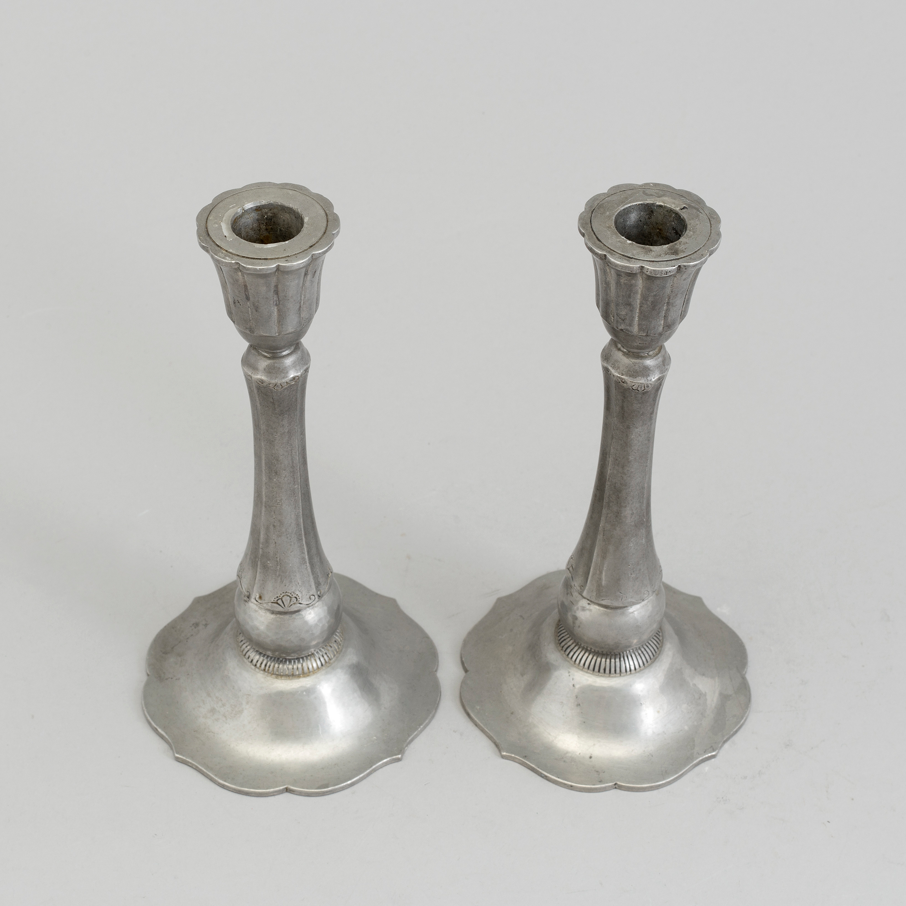 a pair of pewter candlesticks by Just Andersen Denmark. Bukowskis
