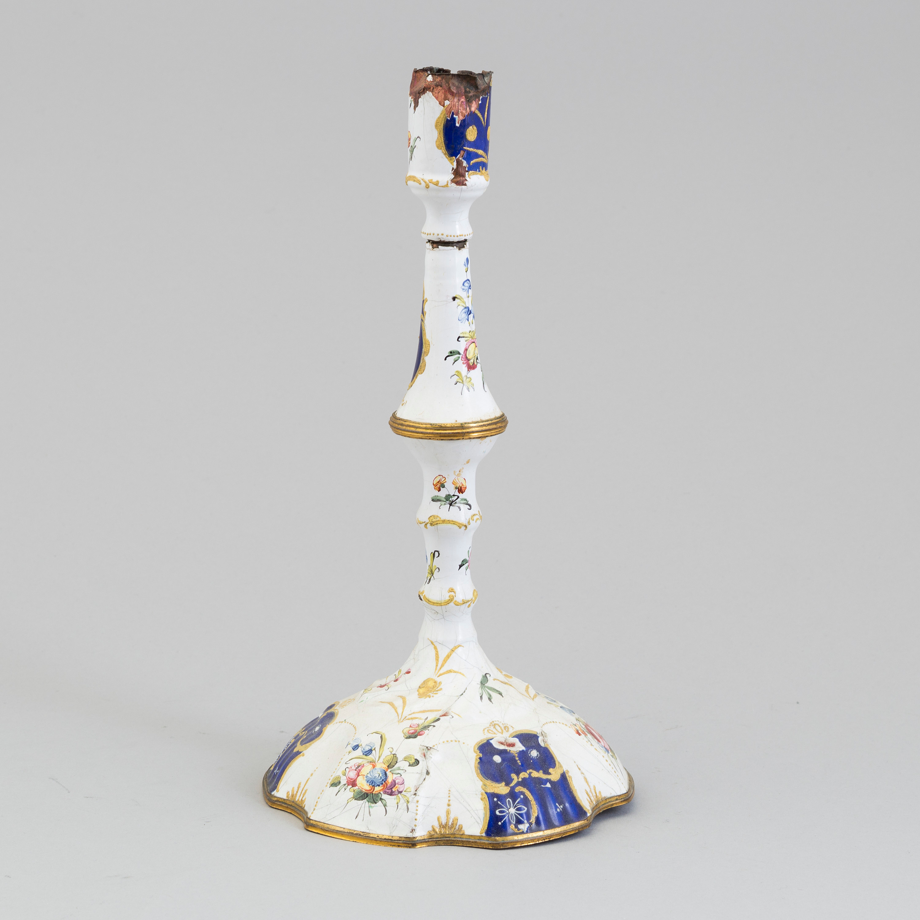 A late 18th Century Bilston Battersea enamel candlestick. Bukowskis