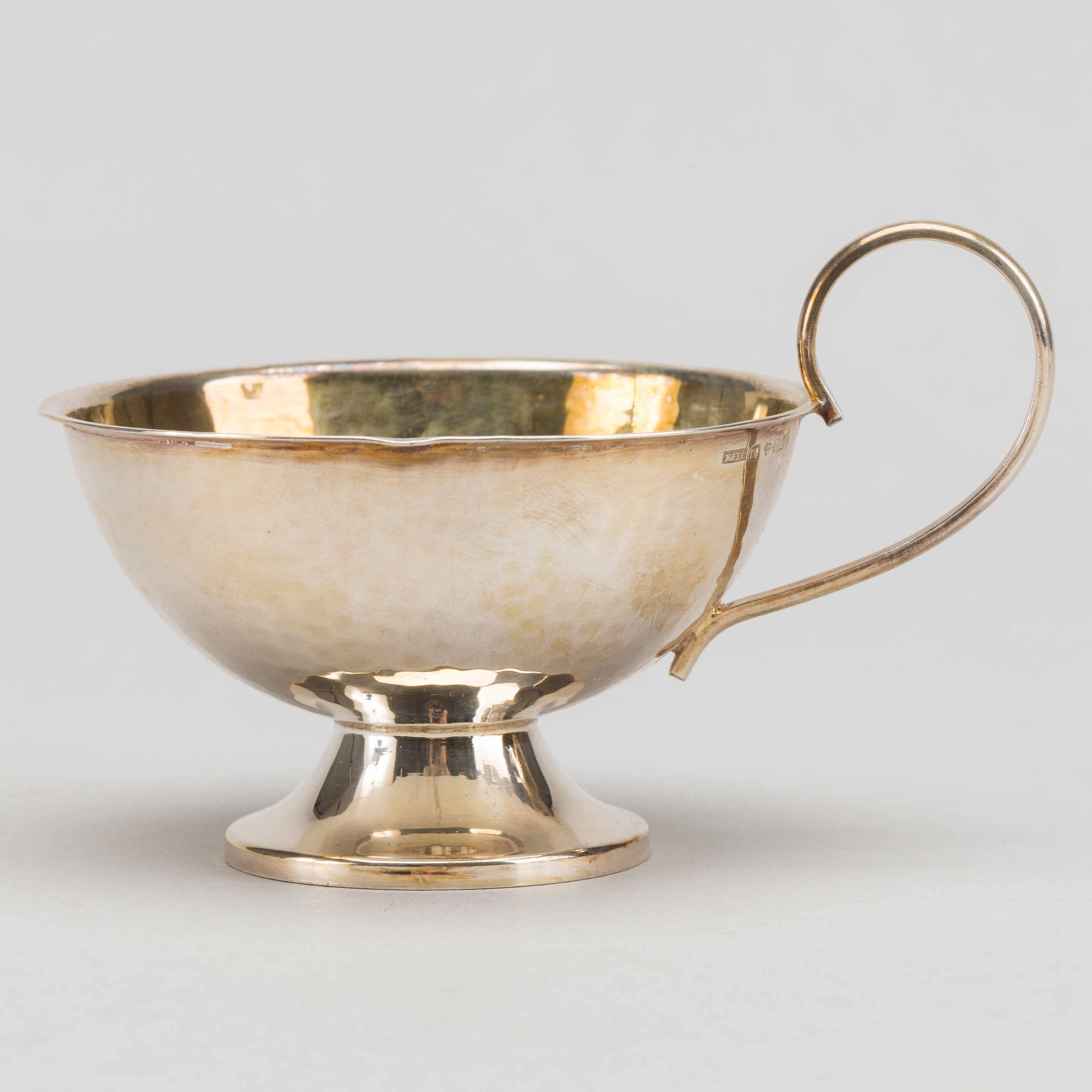 12 1960's silver punch cups. App. 400 gram. Bukowskis