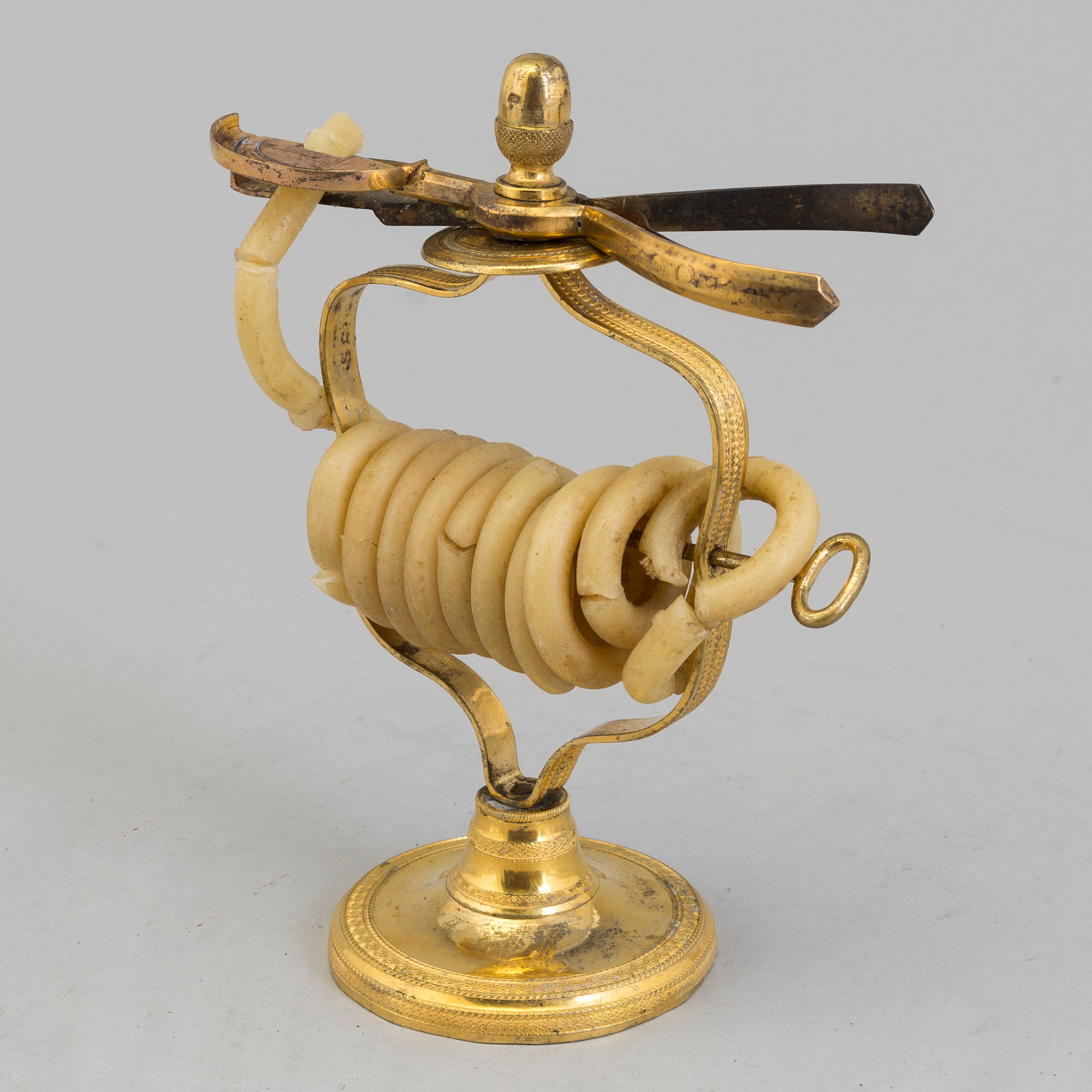 An early 19th century gilt brass candle / candle cutter. Bukowskis