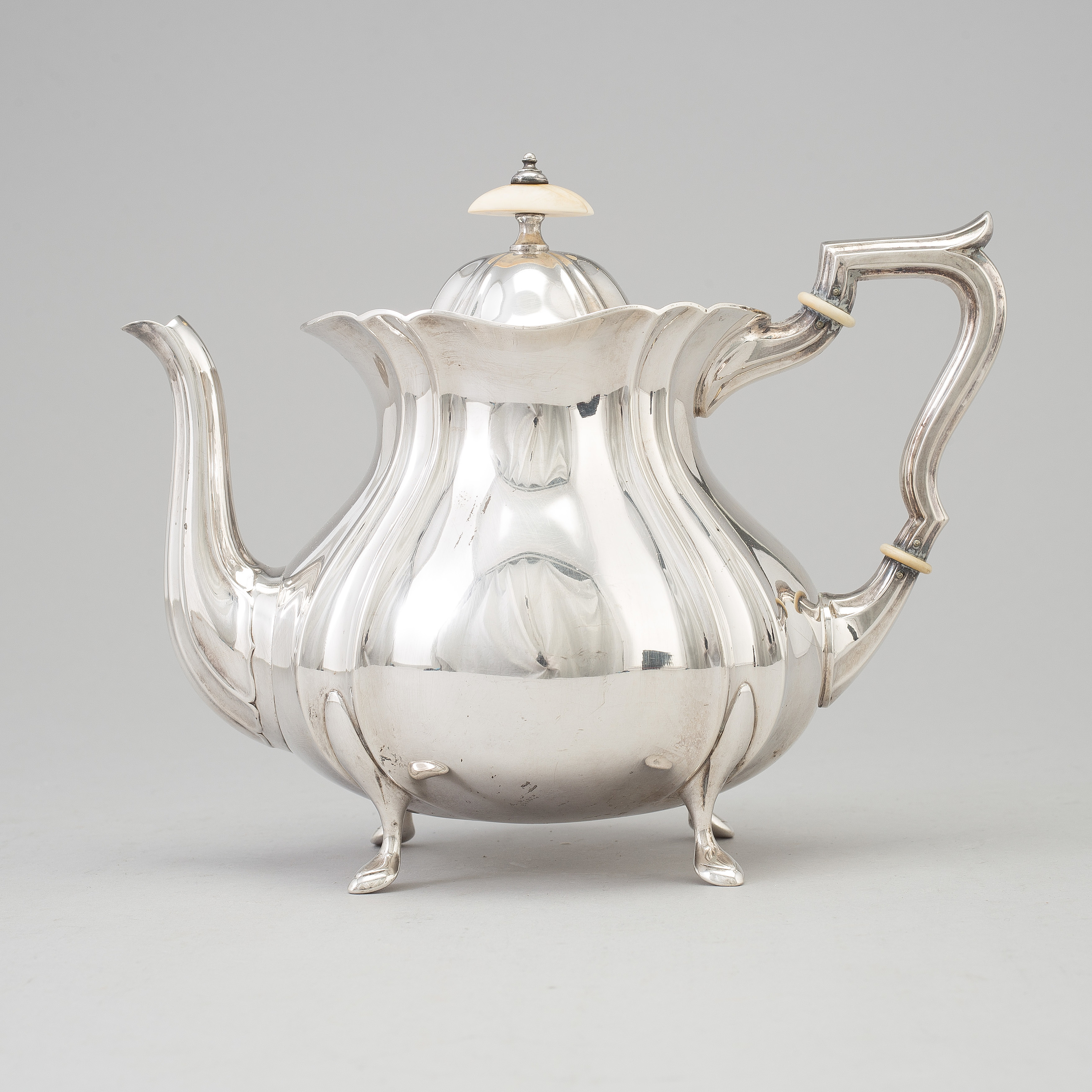 A Swedish rococostyle silver teapot, maker's mark GAB, Stockholm, 1927