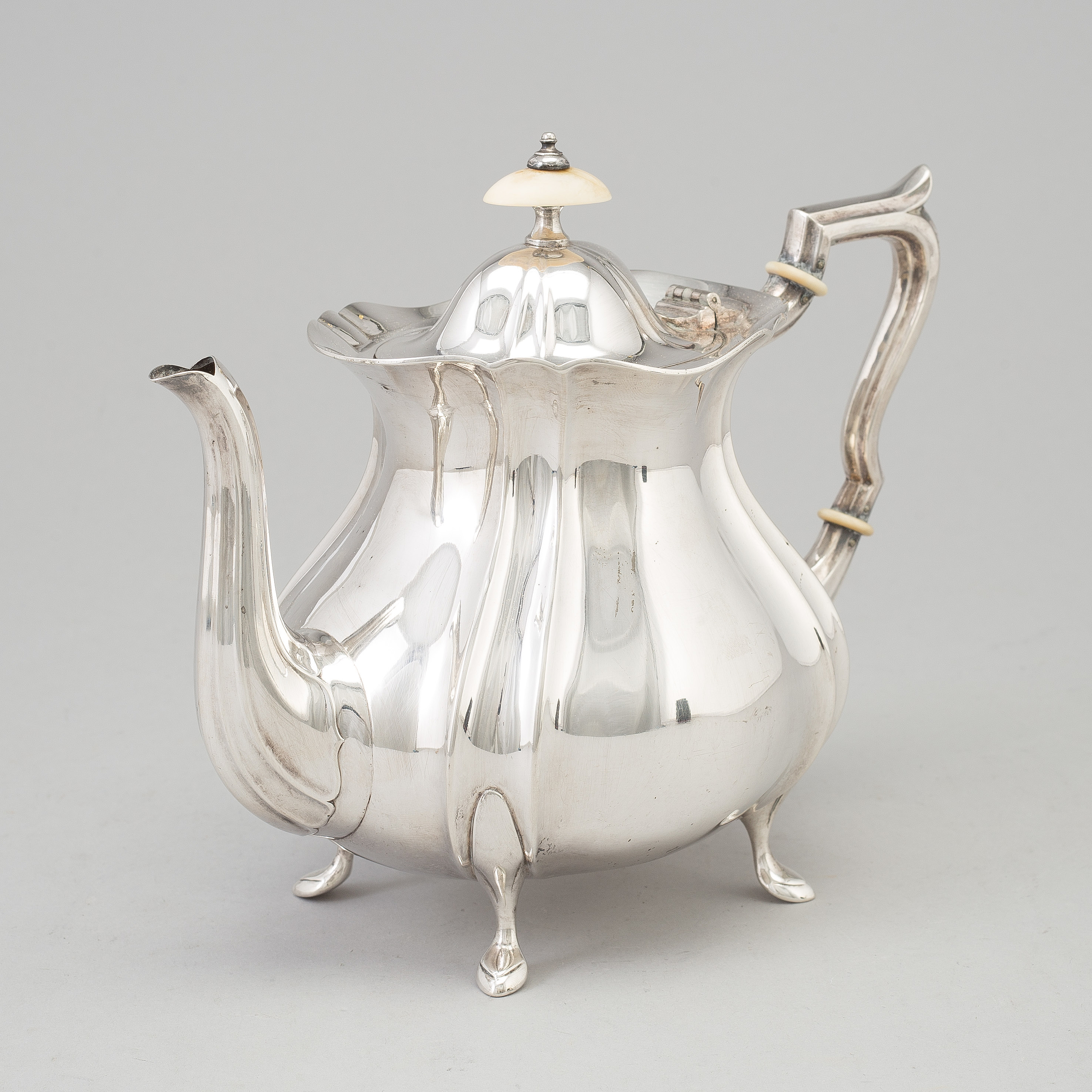 A Swedish rococostyle silver teapot, maker's mark GAB, Stockholm, 1927